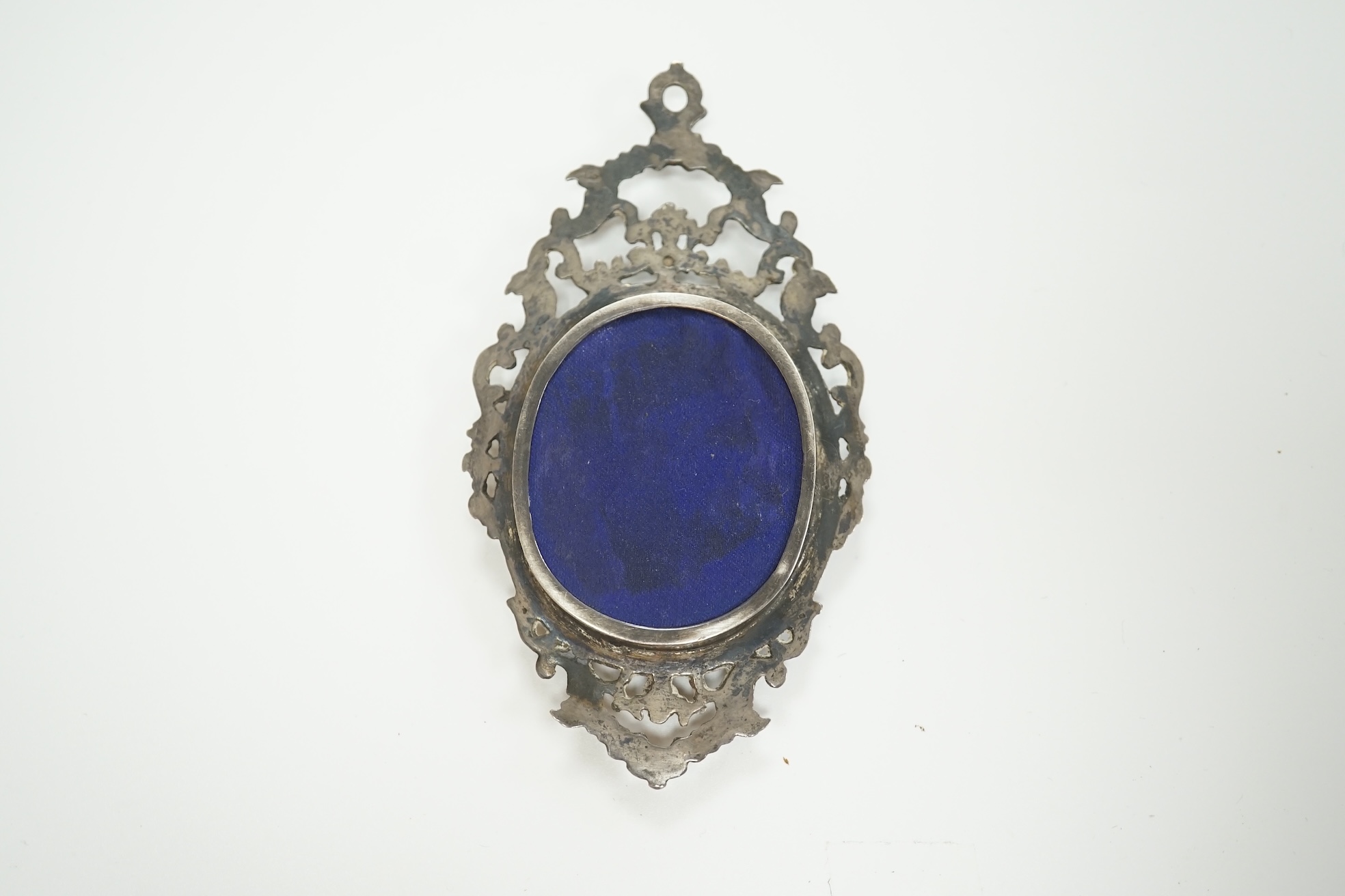 English School circa 1840, watercolour on ivory miniature portrait of a young lady with ringlets, size overall 10cm high, housed in an ornate silver frame. CITES Submission reference 8JBKVYPE. Condition - fair to good